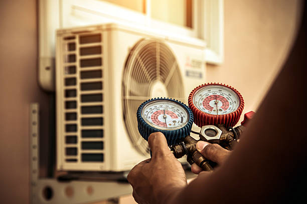 Professional Heat Pump Repair technician working in Le Claire, IA